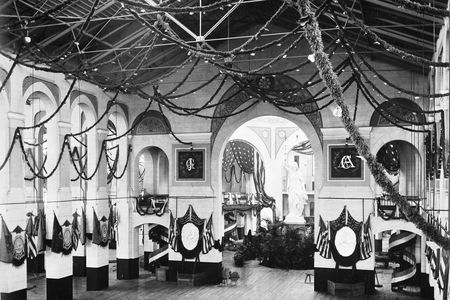 Smithsonian’s Arts and Industries building decorated for James Garfield’s inaugural ball, complete with string light garlands and patriotic buntings.