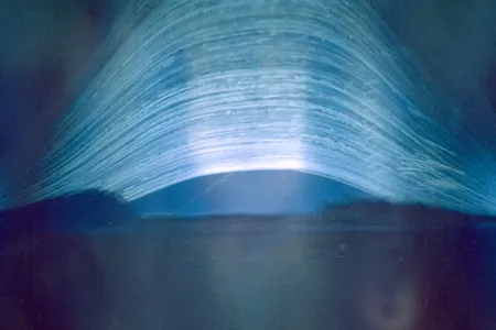 Regina Valkenborgh's photograph features 2,953 arcs of light streaking across the sky, recording the sun’s rising and setting over eight years.