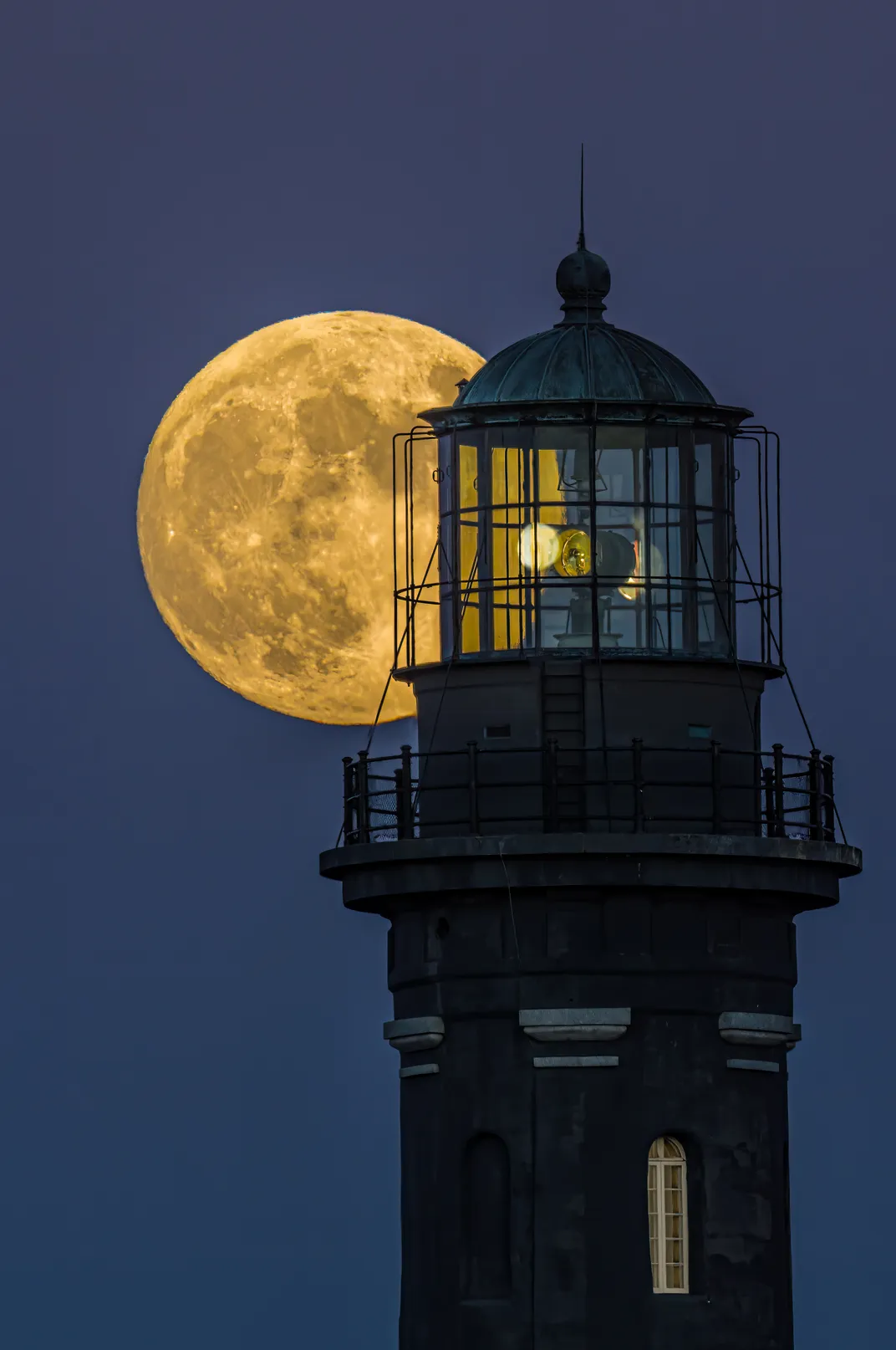 8- Powerful as it may be, on this evening, the lamp from the Fire Island Lighthouse is no competition for the illumination from the full moon.