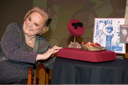 Rose Marie posing with her iconic black bow.