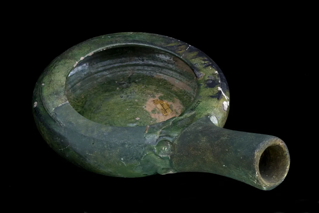green earthenware bedpan