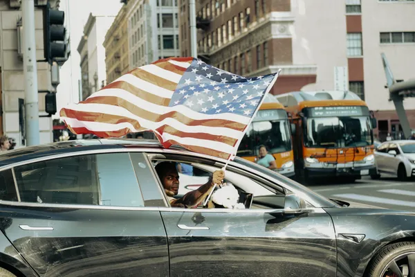 Waving Flag Out Of The Passenger Side Window thumbnail