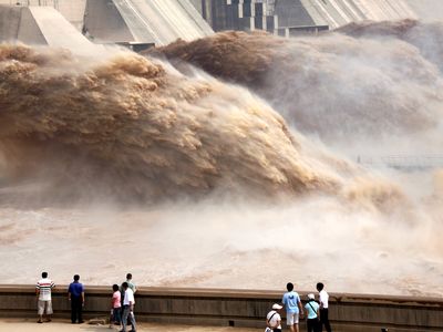 Floodwaters gushing through a dam on the Yellow River. 
