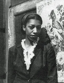 A black and white photograph portrait of a young Black woman.