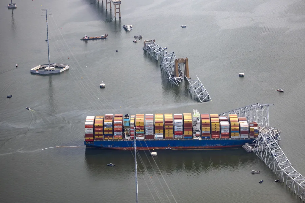 Cargo ship and collapsed bridge