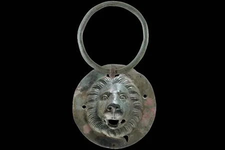 One of the lion&#39;s head discs discovered in the grave