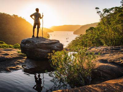 A hiker soaks up the scenery as the sun sets in Ku-Ring-Gai Chase National Park in Sydney.