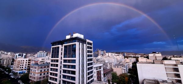 The shadow of a rainbow over the city thumbnail