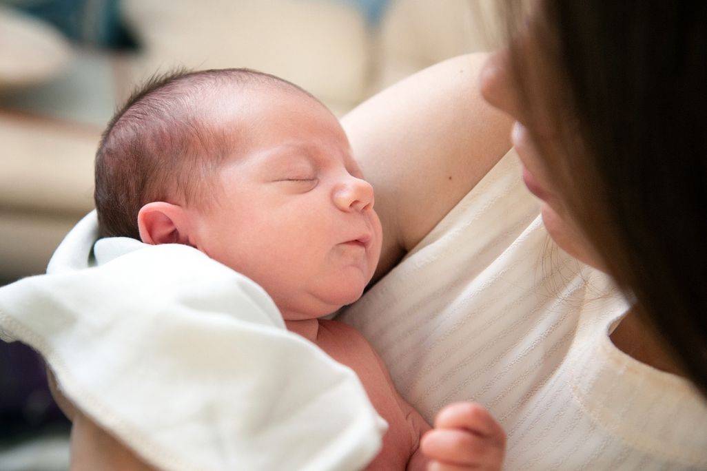 Woman with baby in her arms