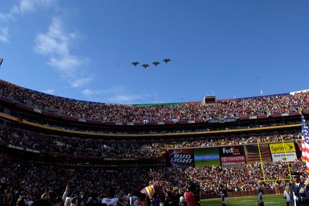 F-22 Raptors from the 1st Fighter Wing at Langley Air Force Base, Virginia, fly over a Washington Redskins vs. Dallas Cowboys football game in 2006.