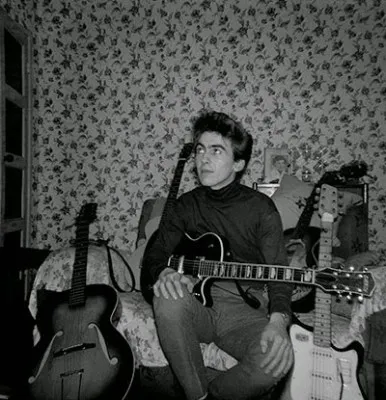 Young George Harrison with a guitar