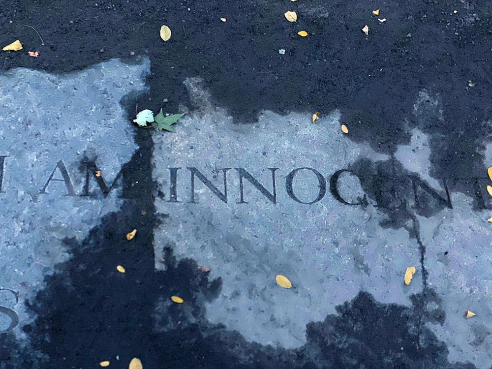 Gray stone etched with the words, I am innocent.