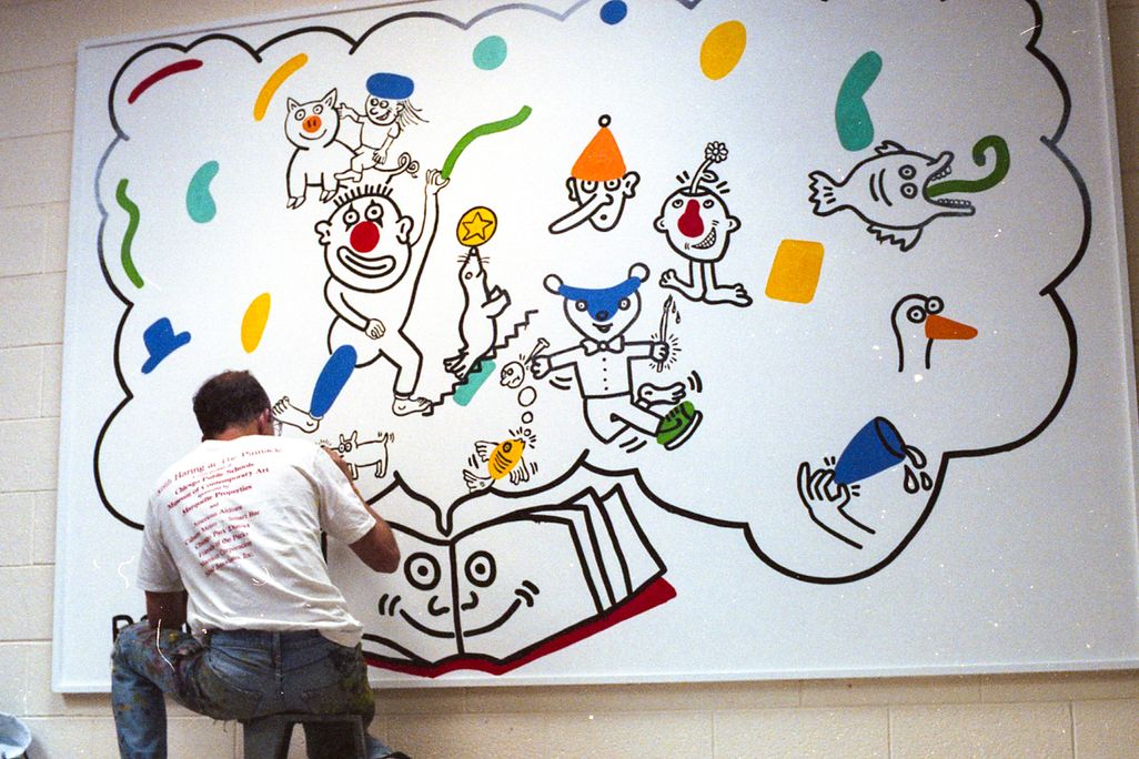 Keith Haring at work on the mural at Ernest Horn Elementary School