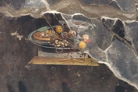 A recently unearthed fresco at a house in Pompeii shows a flatbread that could have been a precursor to pizza.