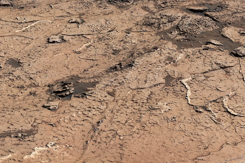the surface of mars with a pattern of ridges