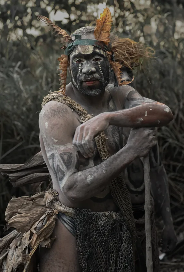A Swagap tribesman poses on his staff thumbnail