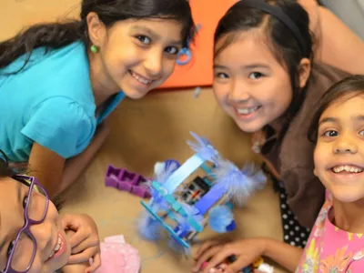 Girls get taught simple circuits, but how they decorate their robots is up to them.