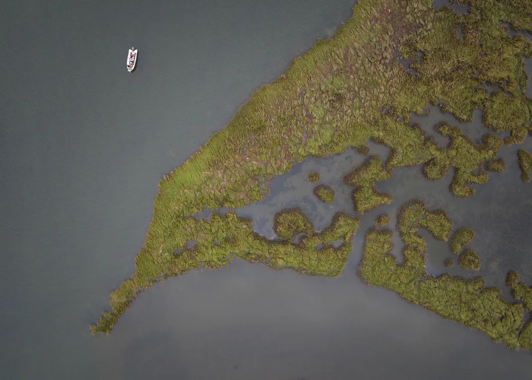 a aerial view of a person fishing from a boat