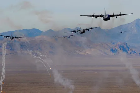 U.S. Air Force C-130 Hercules aircraft fire chaff and flare countermeasures over the Nevada Test and Training Range Nov. 17, 2010.