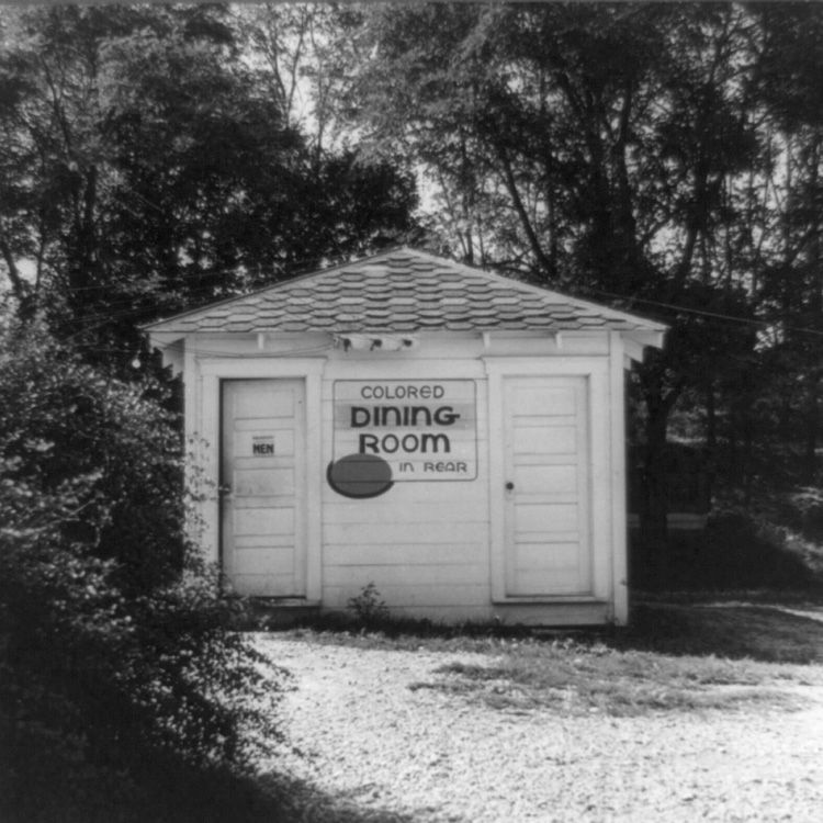 Rest stop bathroom with sign "Colored Dining Room in Rear"