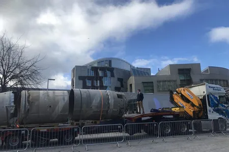 Outside the Scottish Parliament building in Edinburgh, Skyrora executive Owain Hughes views the hulk of the Black Arrow that his company brought home after it sat for 50 years in the Australian outback.