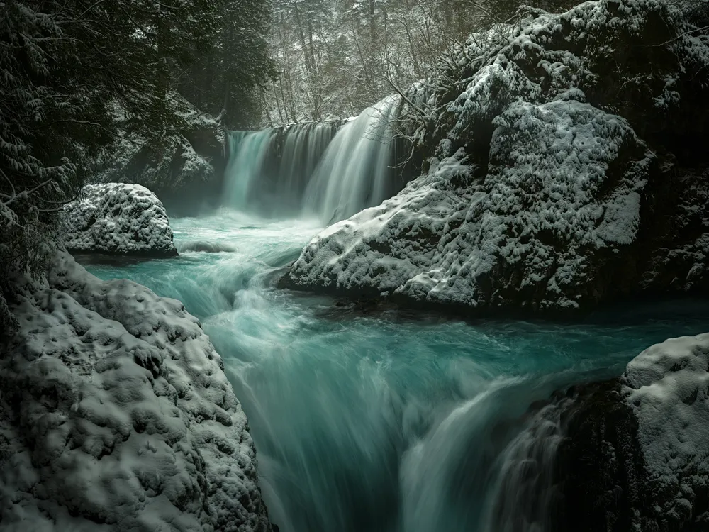 Spirit Falls is a striking waterfall well known to the locals of the Pacific Northwest. Technically on private property, public access to the location has been a subject of debate- the landowners not wanting the liability of the relatively precarious hike, but outdoor enthusiasts pushing for the establishment of an official trail. This photograph was taken while public access was allowed, and at the start of a large snowstorm that, shortly afterward, closed all road access along the Columbia River Gorge.