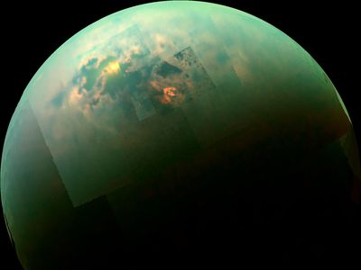 This near-infrared, color mosaic from NASA's Cassini spacecraft shows the Sun glinting off of Titan's north polar seas near the 11 o'clock position at upper left. Titan has environmental conditions close to those that would make silicon life plausible, but silicon itself is lacking.