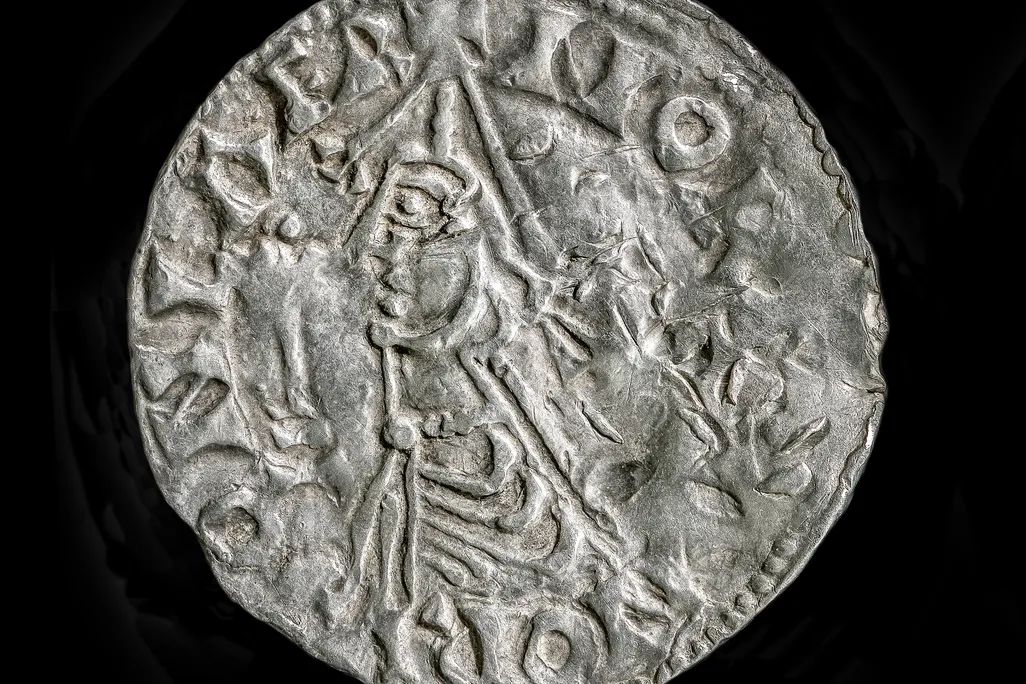A coin against a black backdrop