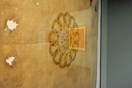 One of the flags is decorated with&nbsp;13 interlocking gold rings labeled with the names of the first 13 states.