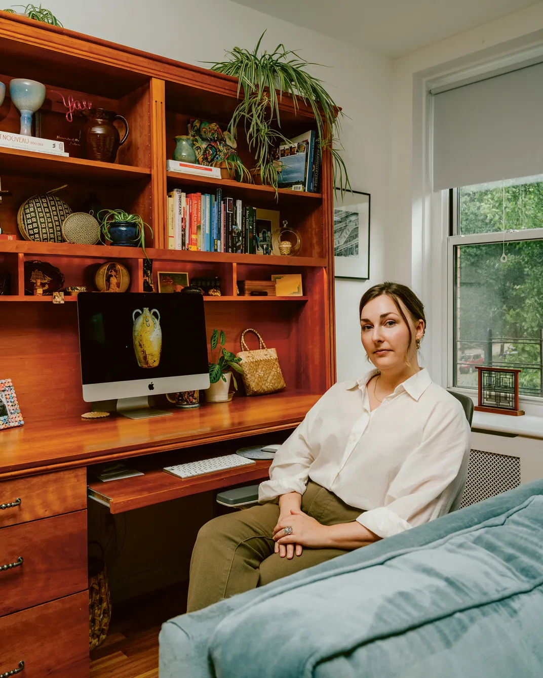 a woman sits for a portait