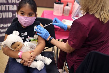A first grade student receives a Covid-19 vaccine in Chicago, Illinois