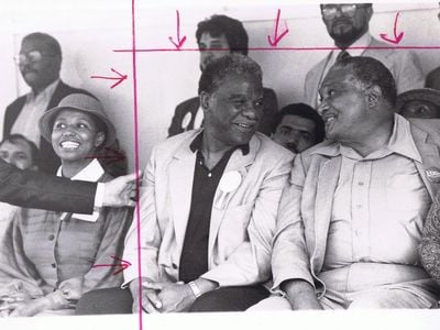 Harold Washington, the first black mayor of Chicago chats to Congressional candidate Charles Hayes. The woman on Washington's right, who was cropped out of the photo, is Carol Moseley Braun; she would go on to become the first African-American woman ever elected to the U.S. Senate.