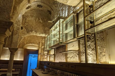 An architect concealed and conserved the historic bathhouse while constructing a hotel on the site in the early 20th century.