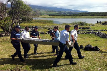 Investigators carry the flap in question. It’s now in a French laboratory undergoing analysis.
