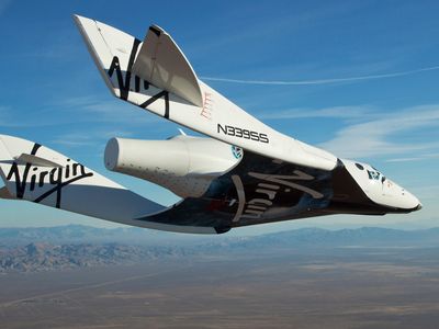 The Virgin Galactic SpaceShip2 (VSS Enterprise) glides toward Earth on its first test flight after being released from its WhiteKnight2 (VMS Eve) mothership over Mojave, California October 10, 2010. The craft was piloted by engineer and test pilot Pete Siebold from Scaled Composites.