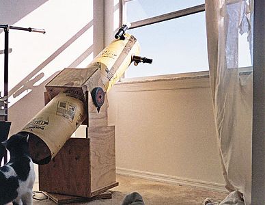 Still life with telescope, feline, and feet. Even the National Air and Space Museum uses a Dobsonian telescope to show visitors the sun.