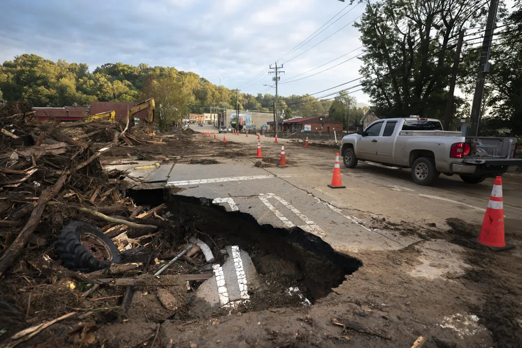 a washed out road from storm damage