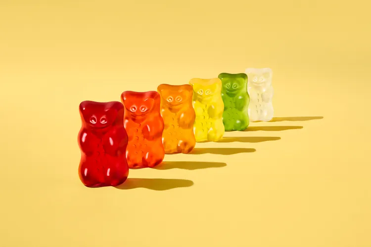 Six Haribo Goldbears standing in a line