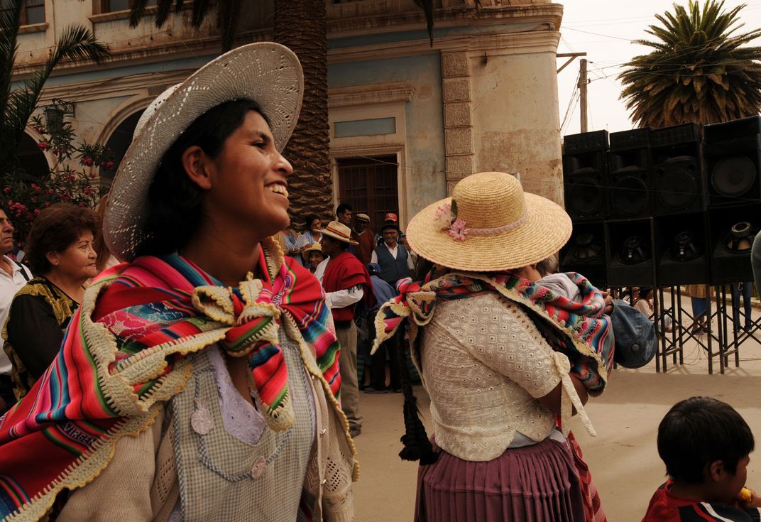 An Indigenous Woman Smiles During A Political Rally In Bolivia