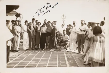 J.D. Salinger (center left with his hand on his chin) on the deck of the M.S. Kungsholm, 1941
