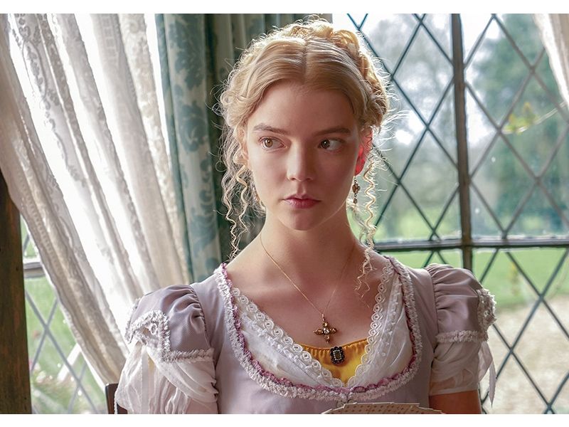 Anya Taylor-Joy playing Emma in front of a windowpane