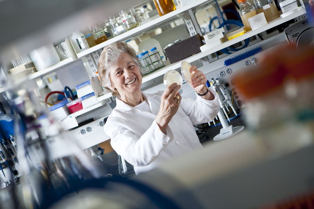 Scientist wearing a lab coat in a lab.