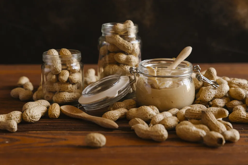 Peanuts and peanut butter on a table