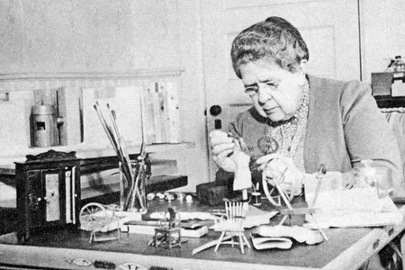 Frances Glessner Lee hard at work on her one of her deadly dioramas, The Nutshell Studies of Unexplained Death.