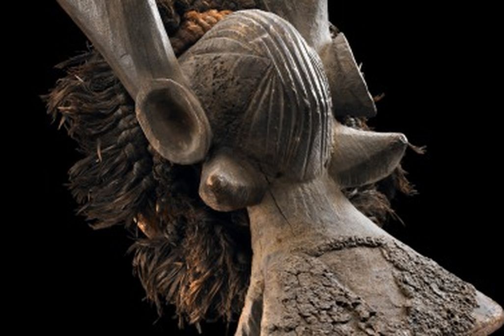 A Yukuben horizontal cap mask blends human and animal features.
