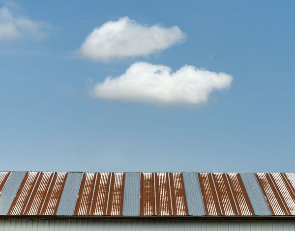 Clouds over barn roof thumbnail