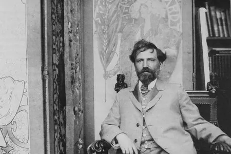 Alphonse Mucha in front of his first poster for Sarah Bernhardt