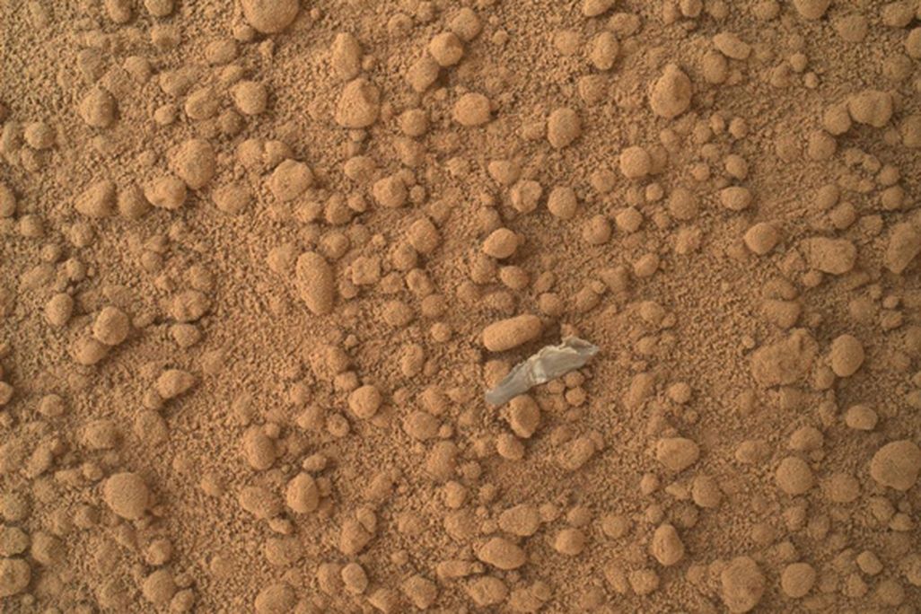 The first shiny object found on Mars, thought to be plastic shed from Curiosity.
