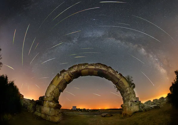 ancient roman aqueduct and meteor shower. thumbnail