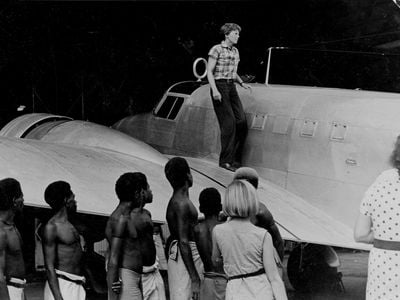 Amelia Earhart on the wing of her plane